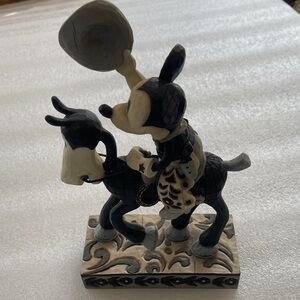 Jim Shore Disney Mickey Mouse on Horseback with Cowboy Hat raised in the air.